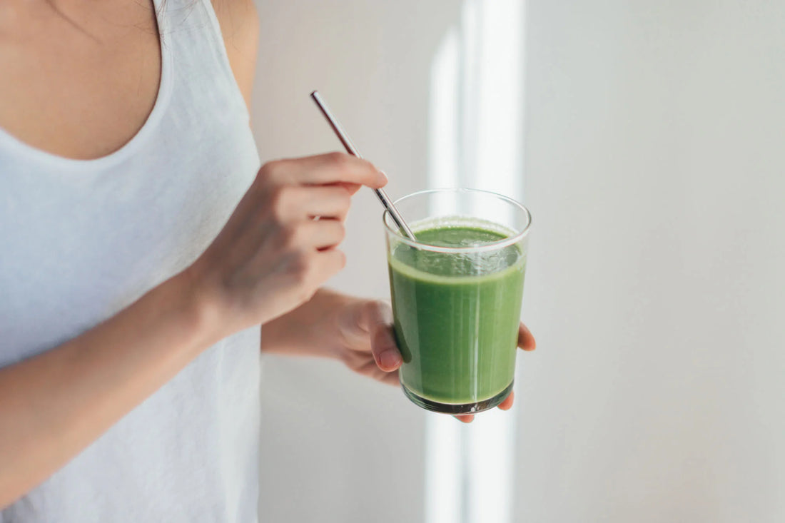 Young Woman Drinking Vegan Smoothie